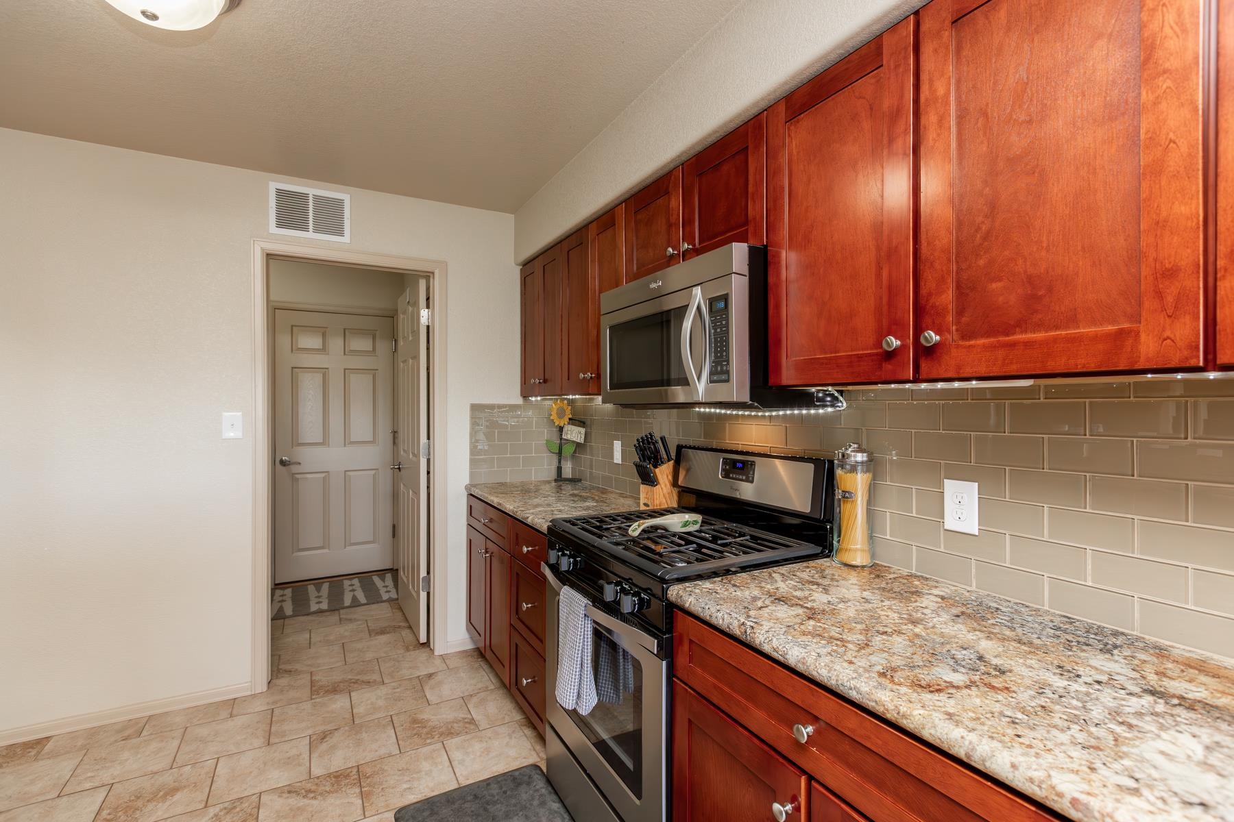 103 Red Rocks Street Fruita, CO 81521 - Photo 29 of 39 a kitchen with a sink stove and microwave