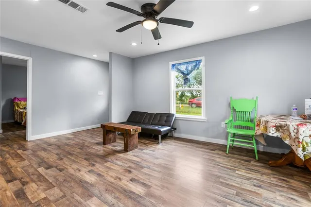 a living room with furniture and a window