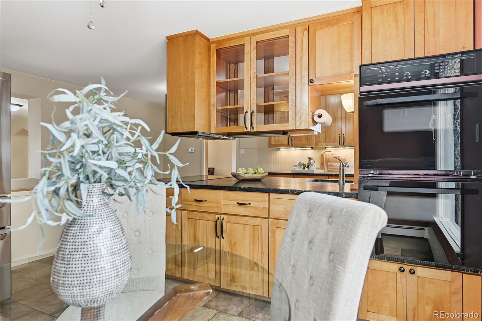 2002 West Ridge Road Littleton, CO 80120 - Photo 12 of 50 a living room filled with furniture and a fireplace