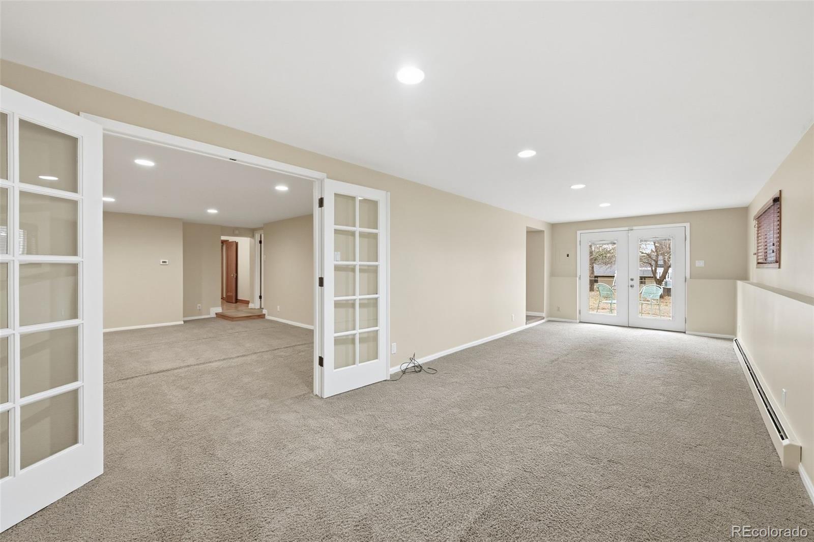 2002 West Ridge Road Littleton, CO 80120 - Photo 23 of 50 a view of an empty room with furniture and window
