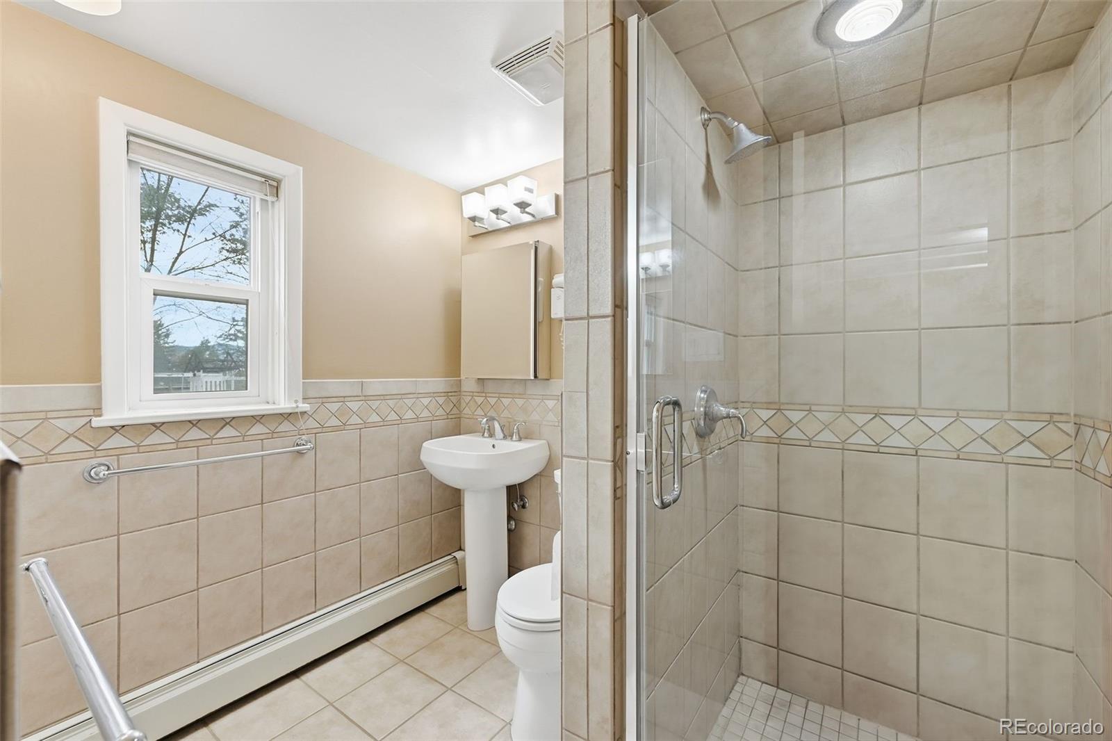 2002 West Ridge Road Littleton, CO 80120 - Photo 25 of 50 a bathroom with a shower