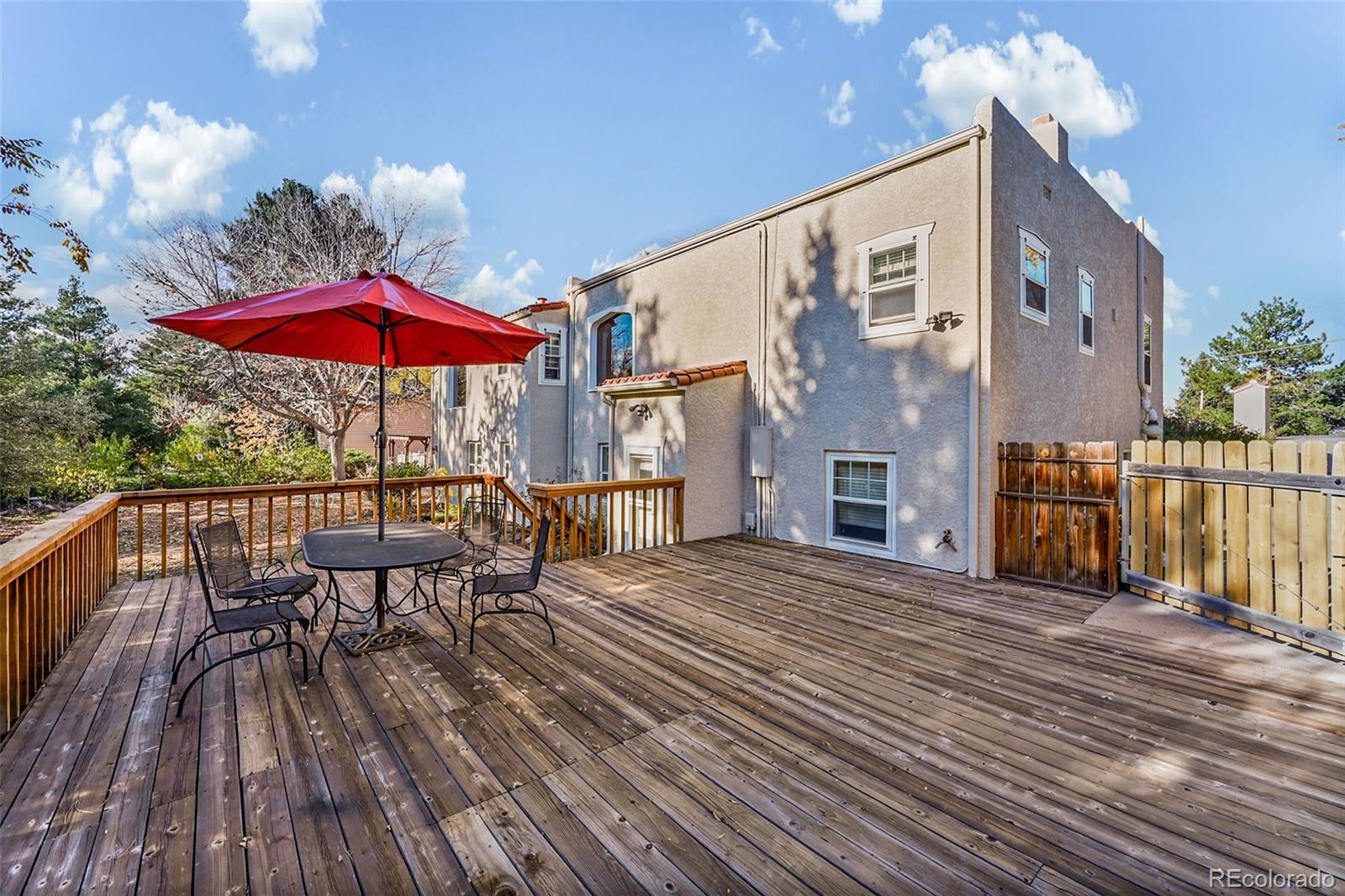 2002 West Ridge Road Littleton, CO 80120 - Photo 31 of 50 a view of a house with roof deck and furniture