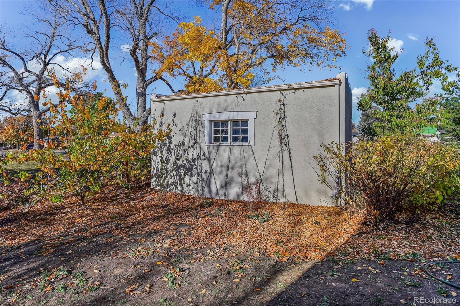 2002 West Ridge Road Littleton, CO 80120 - Photo 42 of 50 a view of a house with a tree