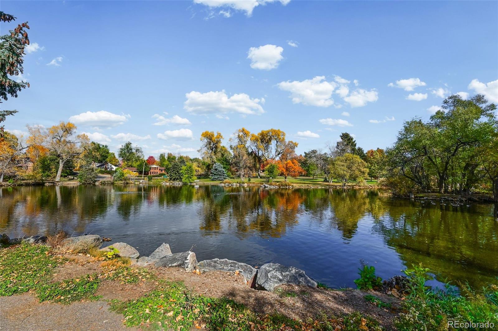 2002 West Ridge Road Littleton, CO 80120 - Photo 46 of 50 a body of water with a house in the background