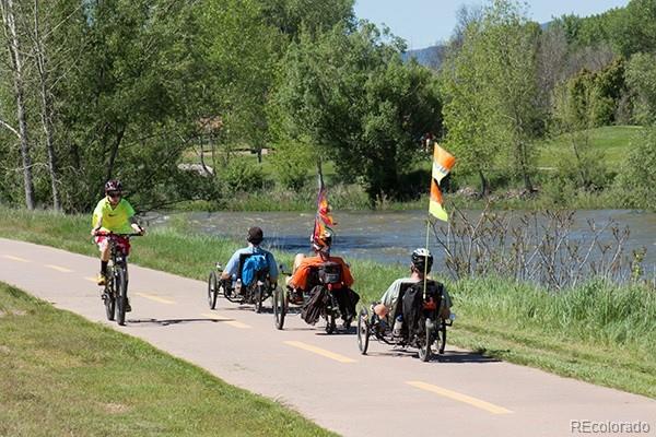 2002 West Ridge Road Littleton, CO 80120 - Photo 47 of 50 a group of people riding bikes down a street