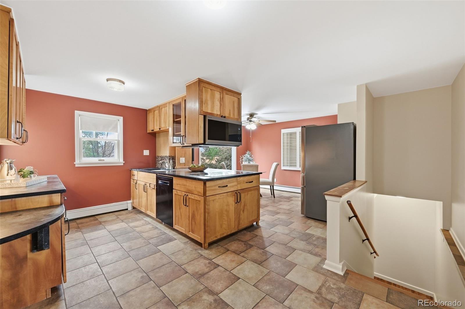 2002 West Ridge Road Littleton, CO 80120 - Photo 8 of 50 a kitchen with stainless steel appliances granite countertop a refrigerator and a stove
