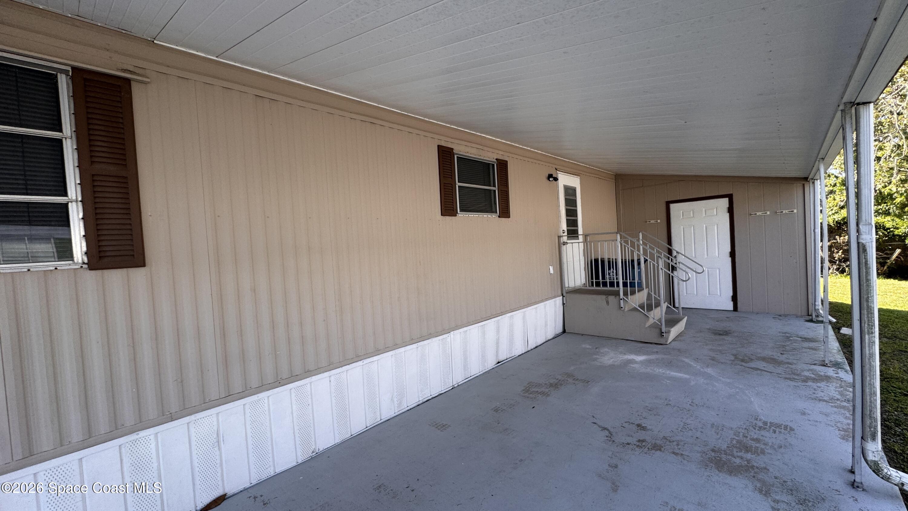 2522 Amberly Road Northeast Palm Bay, FL 32905 - Photo 2 of 13 a view of livingroom with hardwood floor