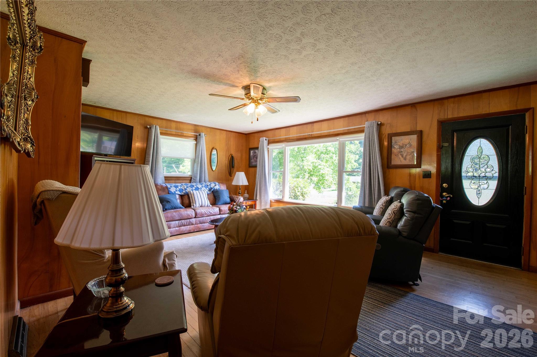 40 Double Island Road Burnsville, NC 28714 - Photo 12 of 38 a living room with furniture a lamp and a window