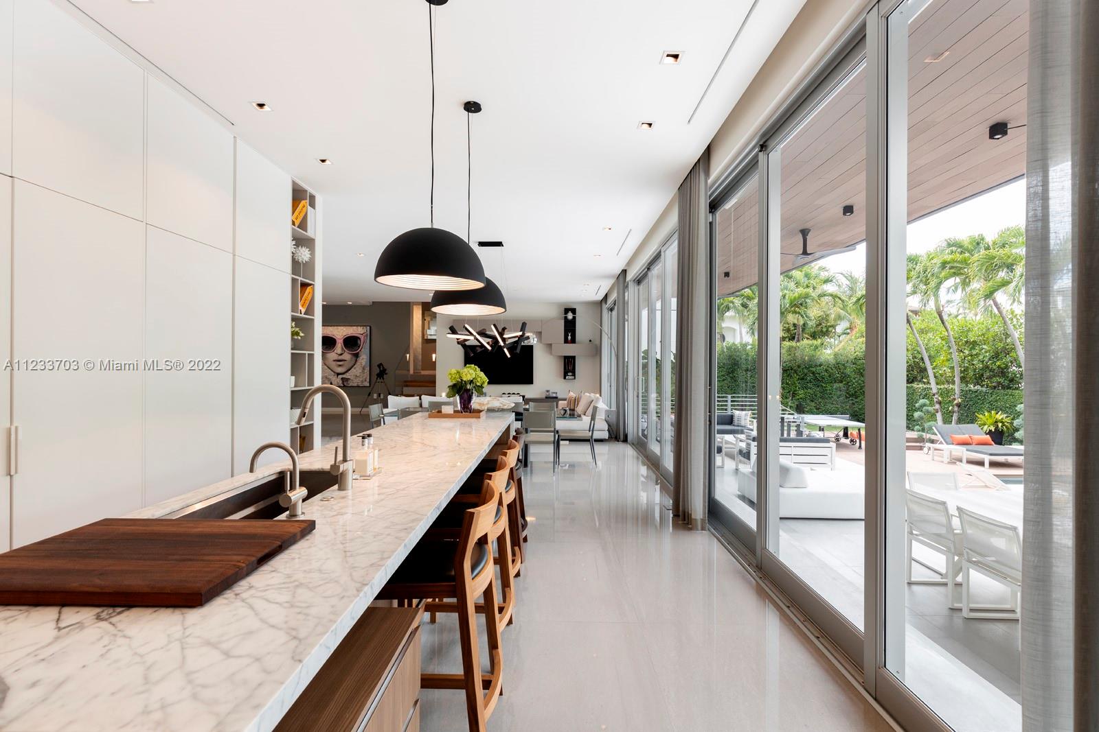 625 Curtiswood Drive Key Biscayne, FL 33149 - Photo 15 of 58 a view of a dining room with furniture window and outside view