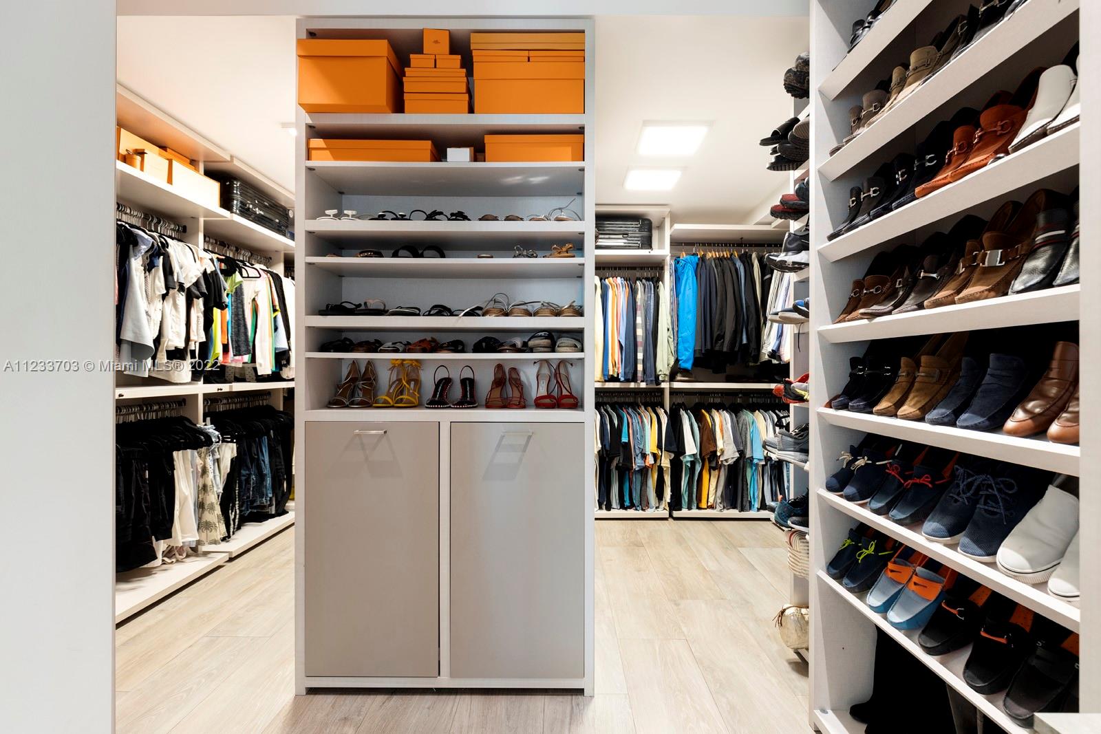 625 Curtiswood Drive Key Biscayne, FL 33149 - Photo 23 of 58 a view of walk in closet with clothes and shoes