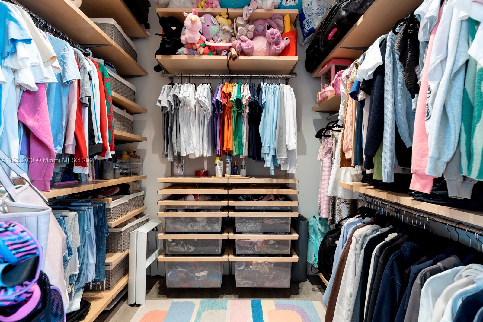 625 Curtiswood Drive Key Biscayne, FL 33149 - Photo 29 of 58 a view of walk in closet with clothes and shoes