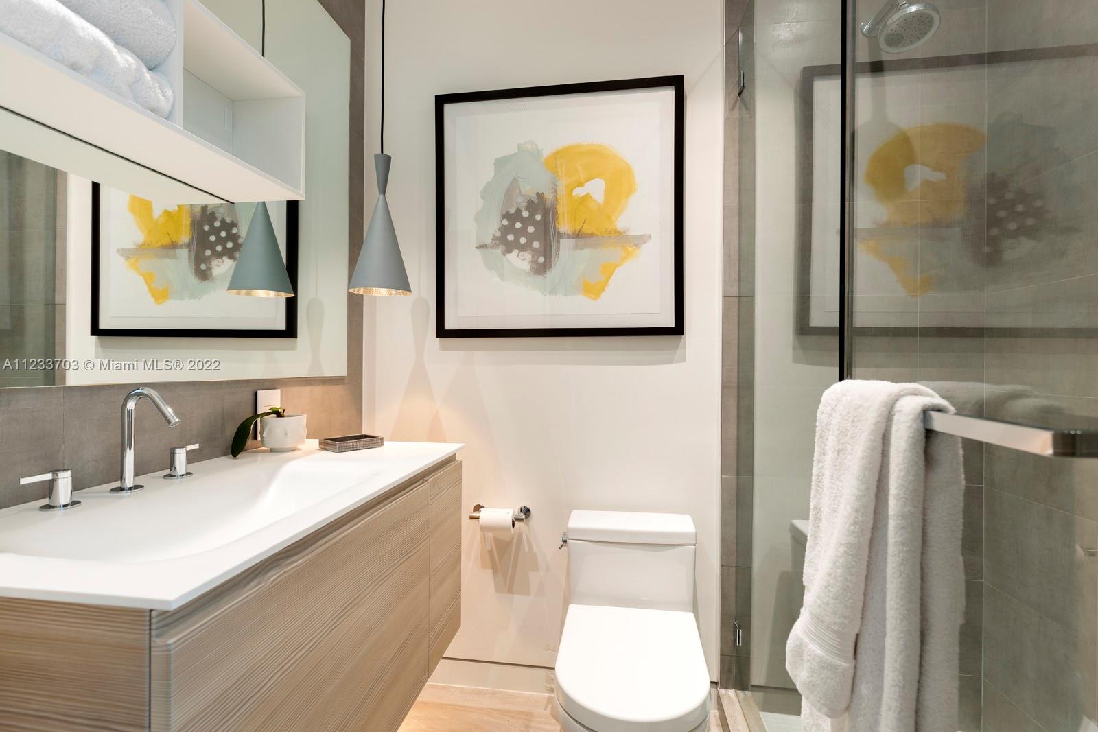 625 Curtiswood Drive Key Biscayne, FL 33149 - Photo 31 of 58 a bathroom with a sink mirror and toilet