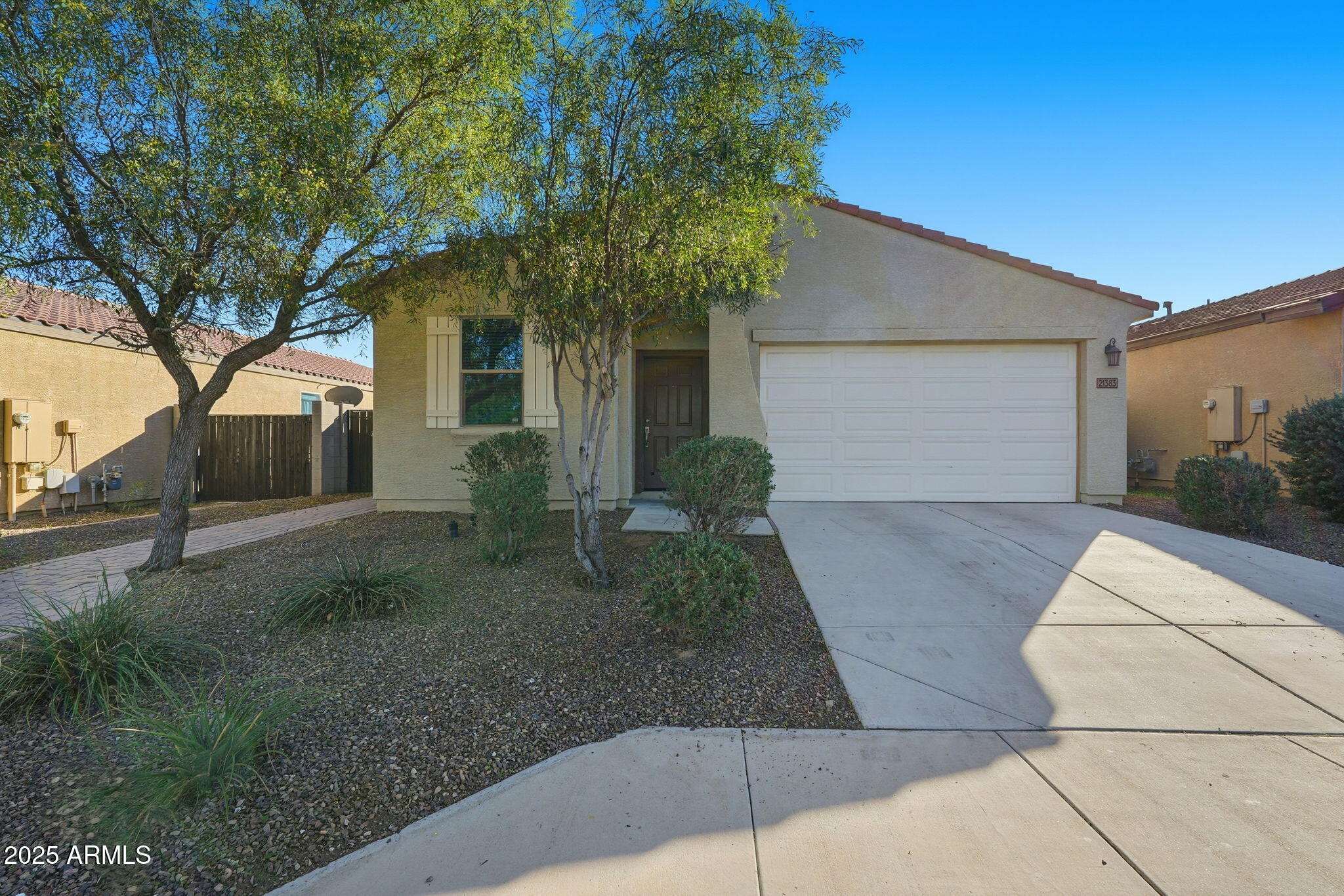21383 West Granada Road Buckeye, AZ 85396 - Photo 1 of 40 a front view of a house with garden