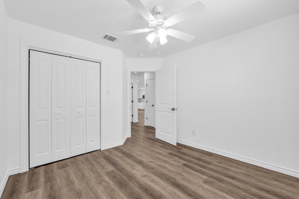 204 North Wiebusch Street Riesel, TX 76682 - Photo 21 of 33 a view of an empty room with wooden floor