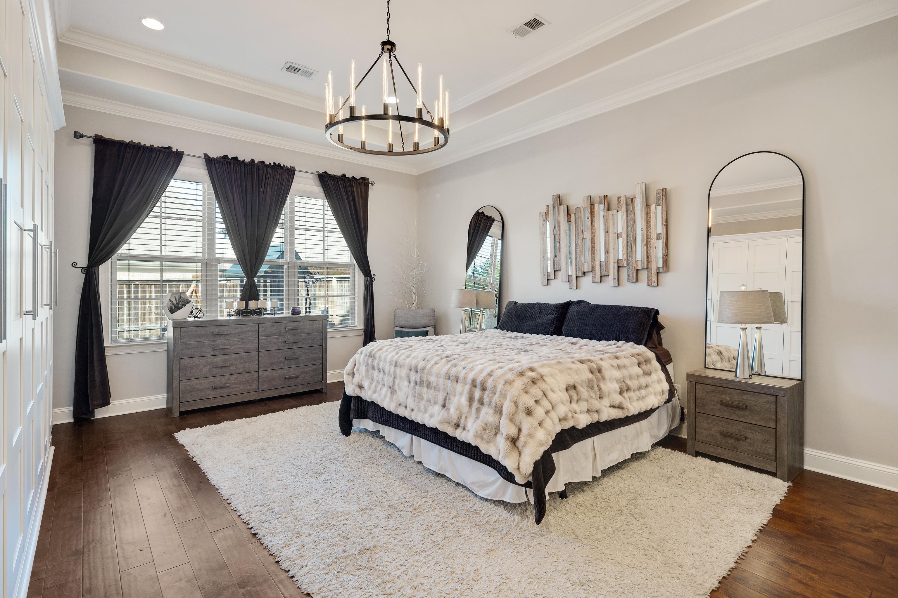 10062 Morning Cross Lane Collierville, TN 38017 - Photo 19 of 39 a bedroom with a bed chandelier and window