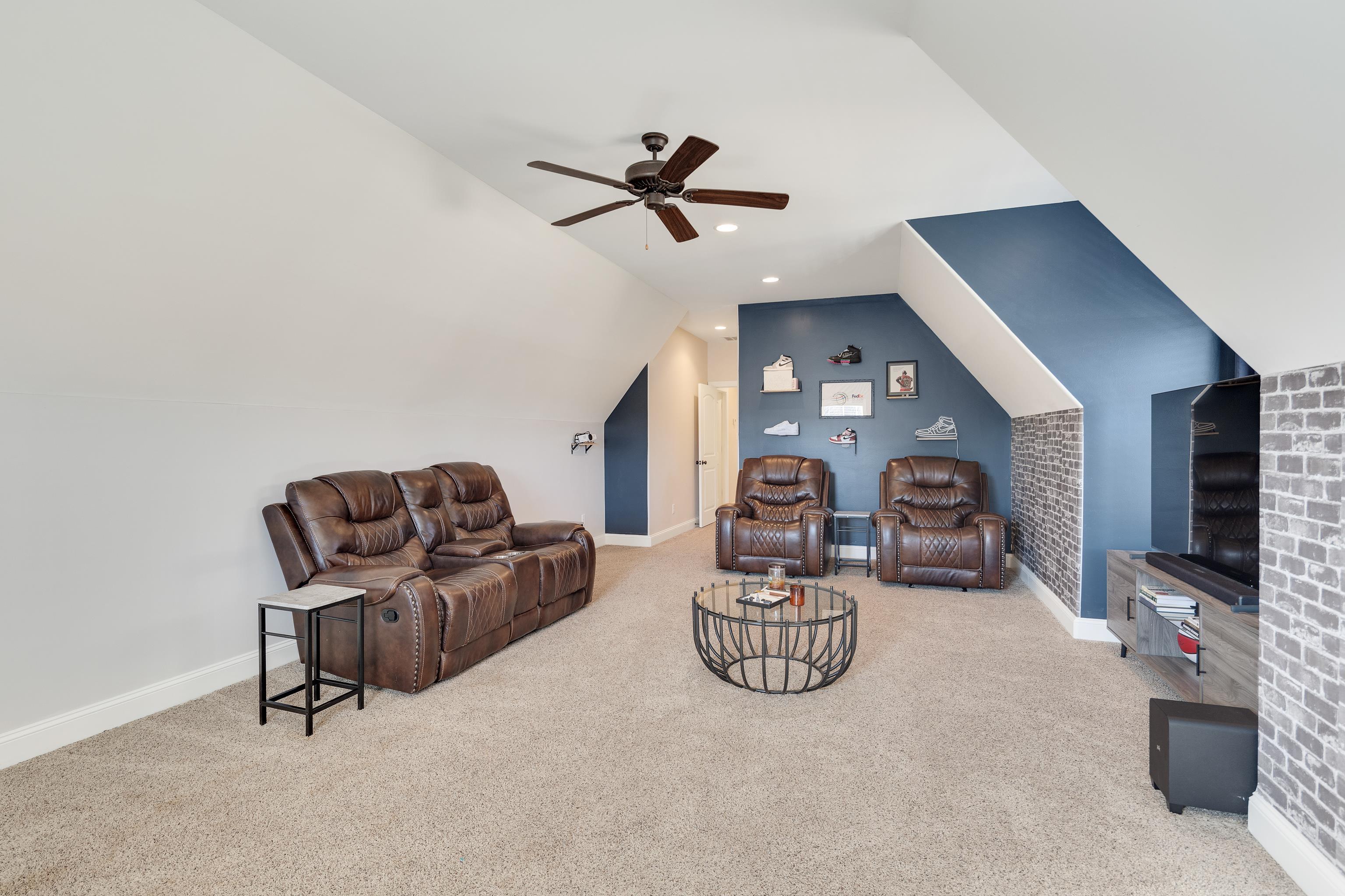 10062 Morning Cross Lane Collierville, TN 38017 - Photo 35 of 39 a living room with furniture a ceiling fan and a rug