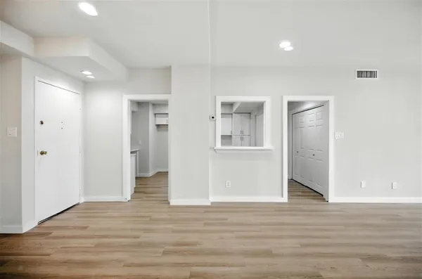 a view of livingroom with hardwood floor and hallway