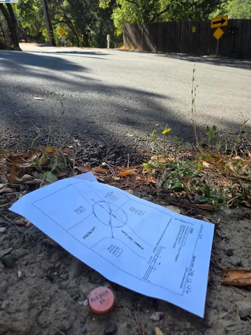 a view of a backyard of the house