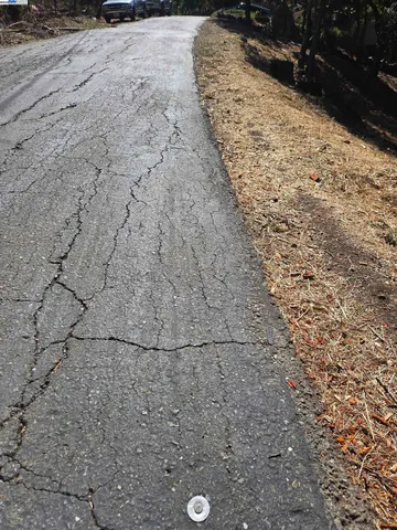 a view of a backyard of the house