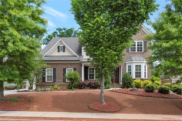 front view of a house with a yard