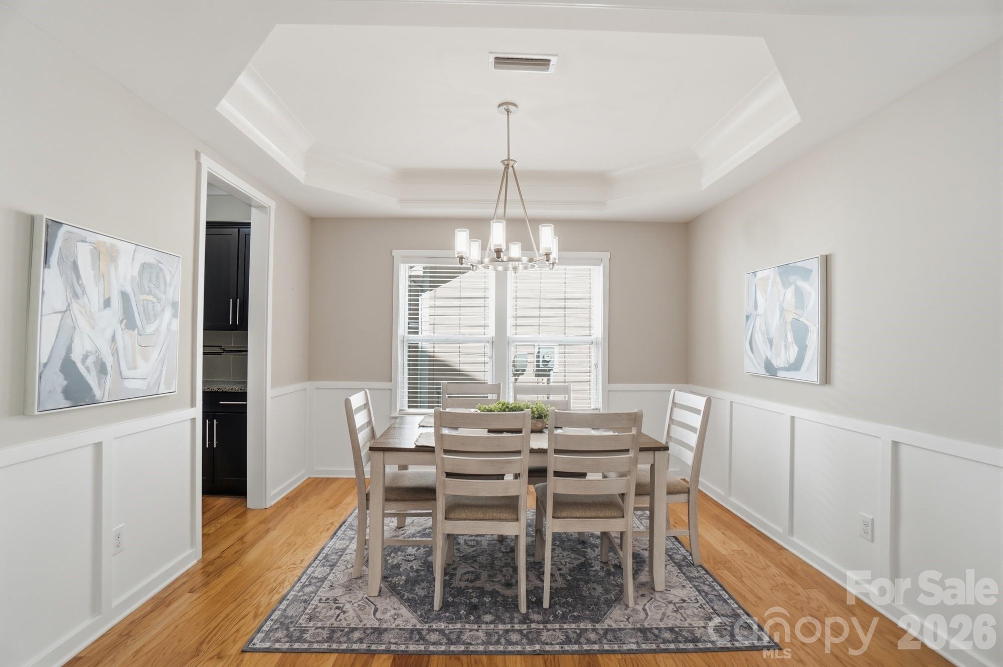 2153 Bluebell Way Tega Cay, SC 29708 - Photo 10 of 48 a view of a dining room with furniture window and wooden floor