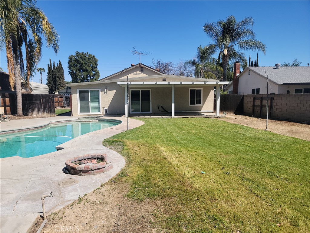 4464 Clarksdale Drive Riverside, CA 92505 - Photo 11 of 23 a view of a house with a yard and potted plants