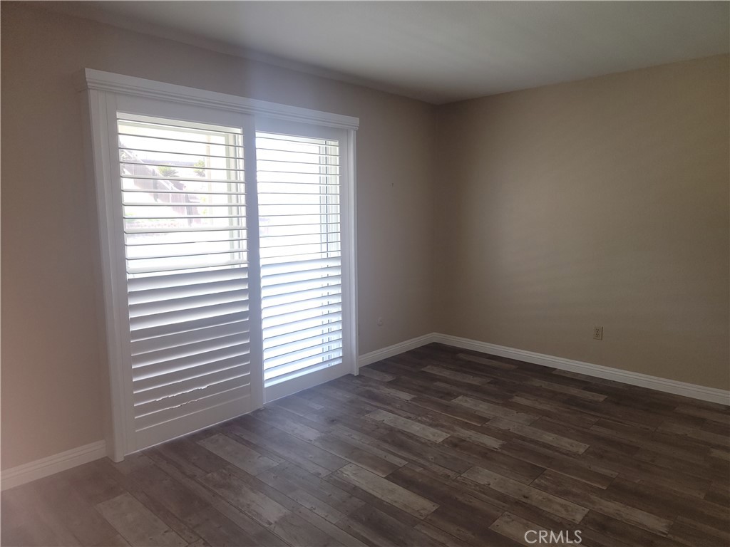 4464 Clarksdale Drive Riverside, CA 92505 - Photo 19 of 23 wooden floor in an empty room with a window