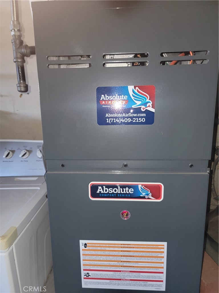 4464 Clarksdale Drive Riverside, CA 92505 - Photo 20 of 23 a view of a hallway with washer and dryer