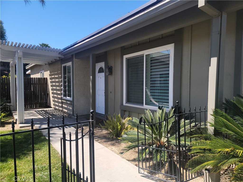 4464 Clarksdale Drive Riverside, CA 92505 - Photo 2 of 23 a front view of a house having yard