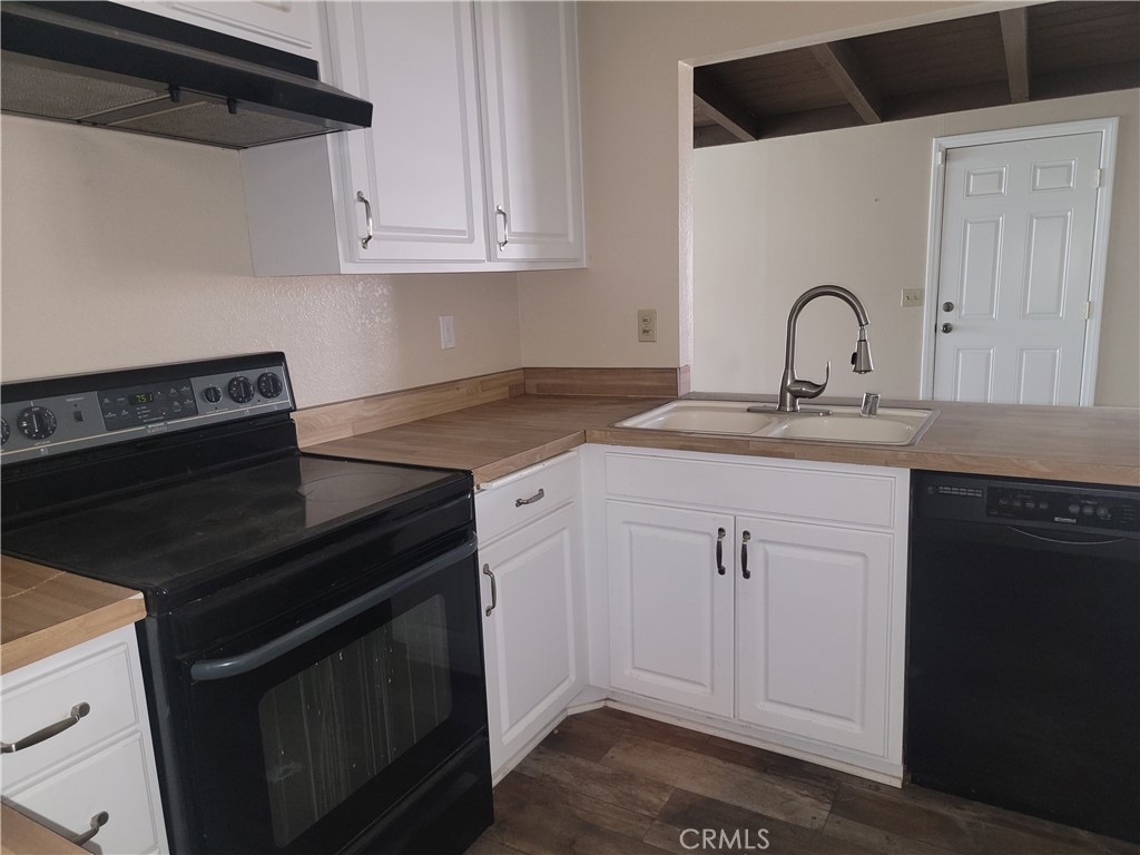 4464 Clarksdale Drive Riverside, CA 92505 - Photo 7 of 23 a kitchen with granite countertop a stove and a sink