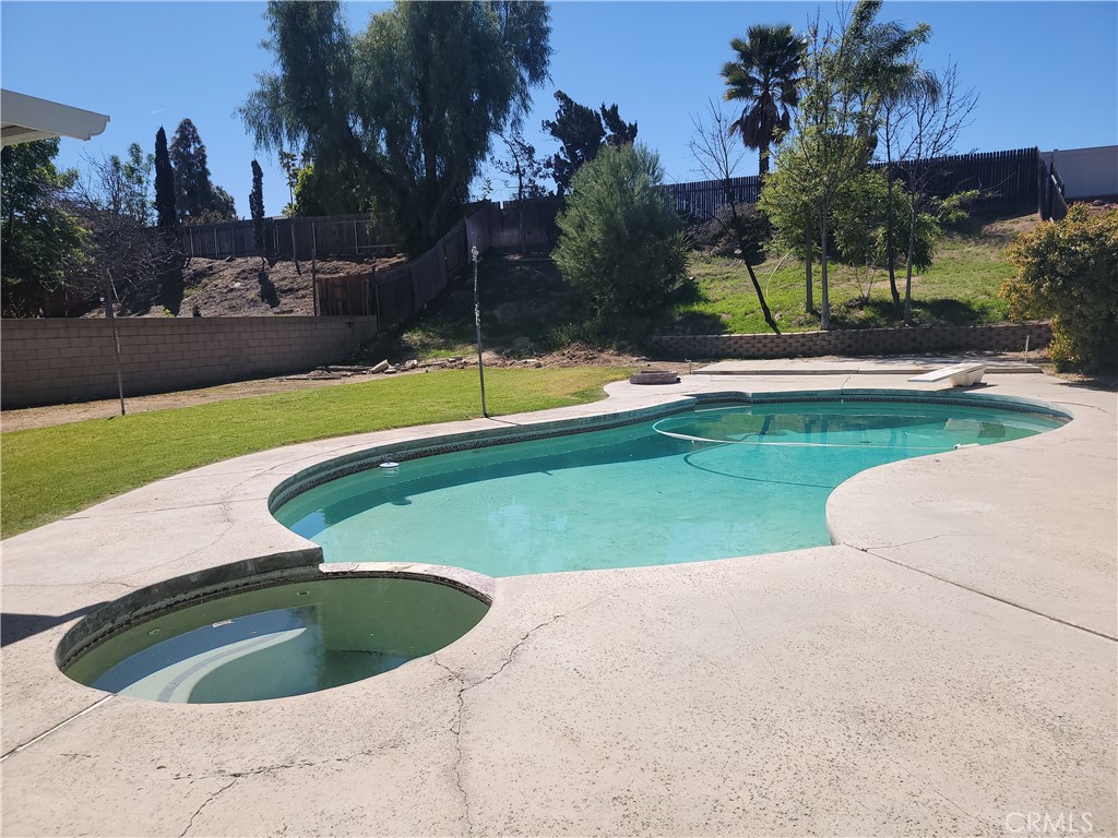 4464 Clarksdale Drive Riverside, CA 92505 - Photo 10 of 23 a view of a swimming pool and a yard