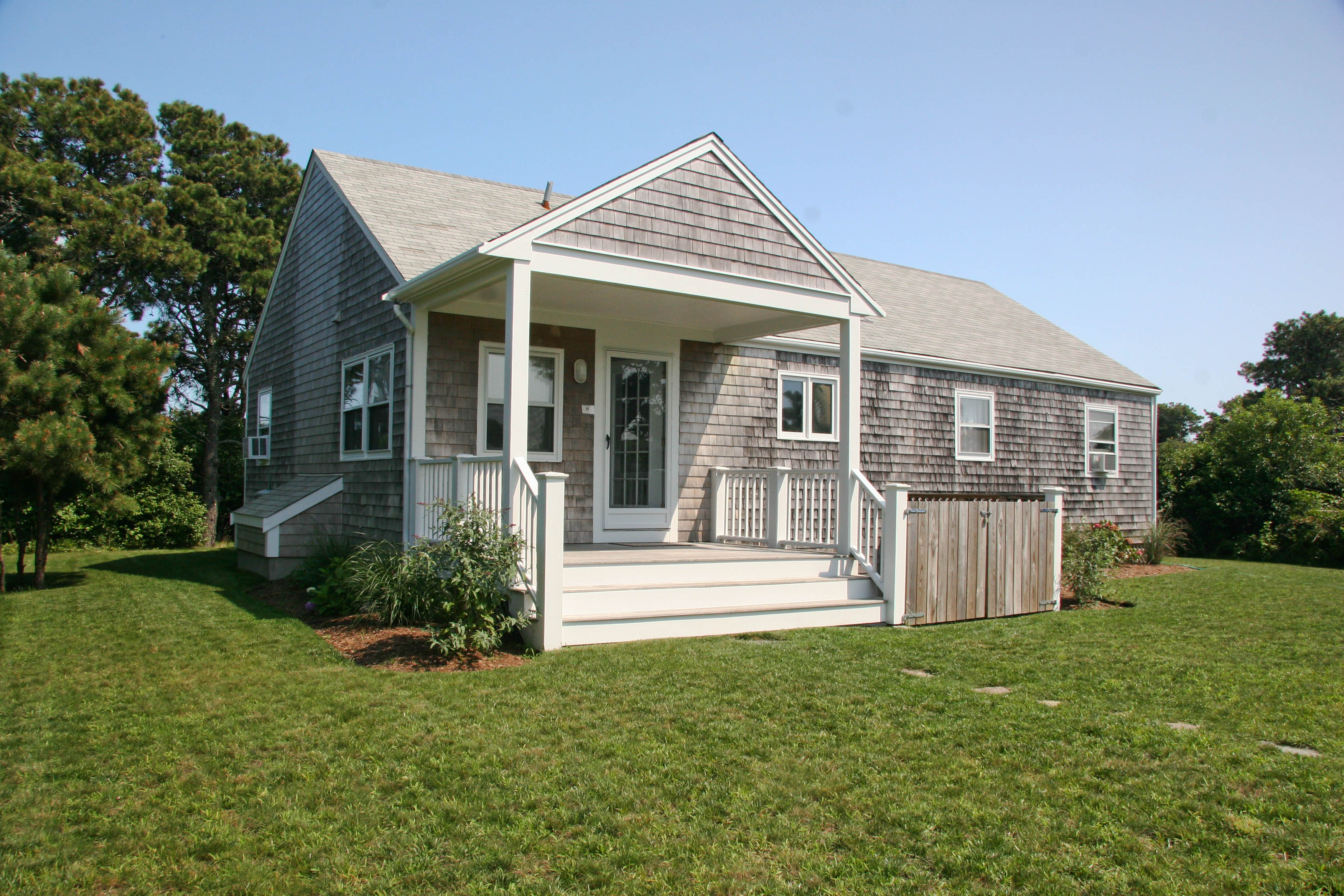 144 Surfside Road Nantucket, MA 02554 - Photo 36 of 46 front view of a house with a yard