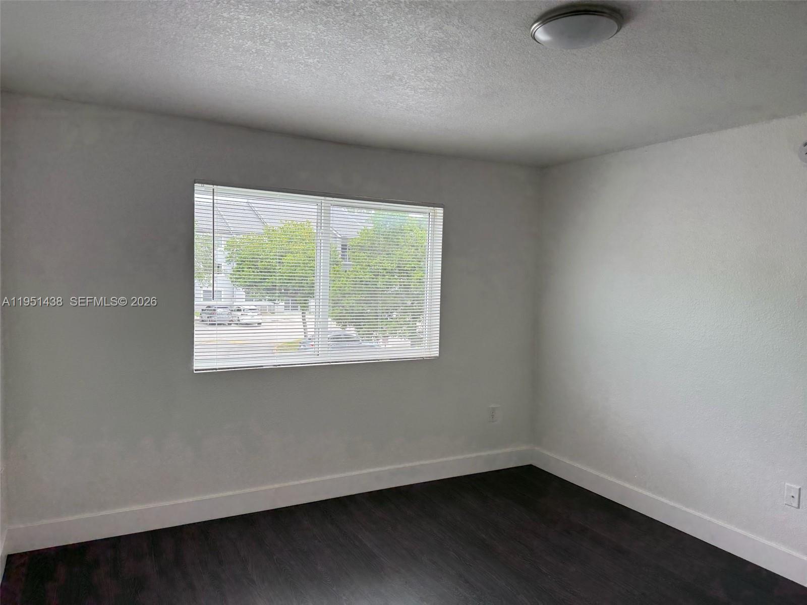 15410 Southwest 284th Street, Unit 8203 Homestead, FL 33033 - Photo 3 of 21 an empty room with a window