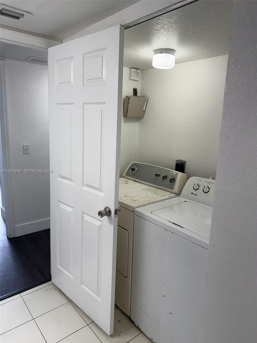 15410 Southwest 284th Street, Unit 8203 Homestead, FL 33033 - Photo 8 of 21 a utility room with dryer and washer