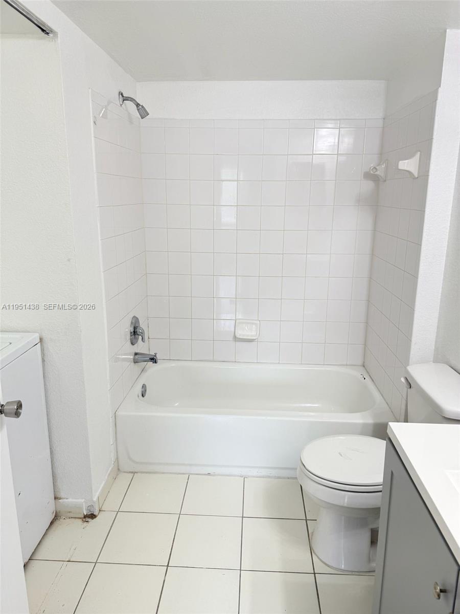 15410 Southwest 284th Street, Unit 8203 Homestead, FL 33033 - Photo 9 of 21 a bathroom with a bathtub a toilet and a shower
