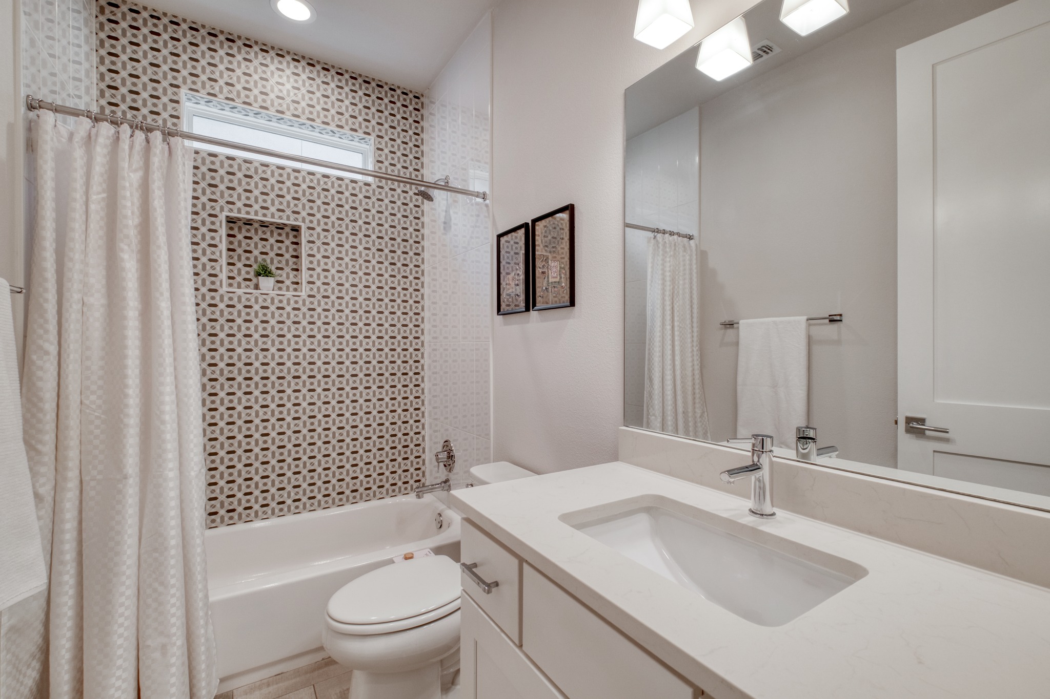 5002 Pecan Springs Road, Unit 7 Austin, TX 78723 - Photo 28 of 34 The top floor bathroom is easily accessible for the fourth bedroom