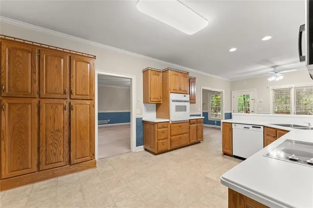 a bathroom with a tub a sink and a large mirror