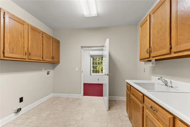 a spacious bathroom with a double vanity sink mirror and bathtub