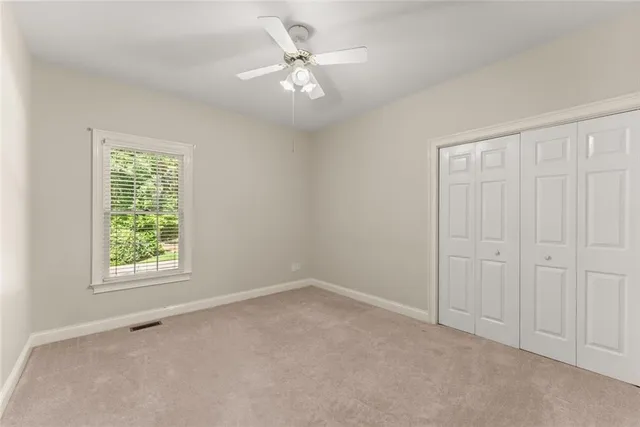 a view of an empty room and entryway