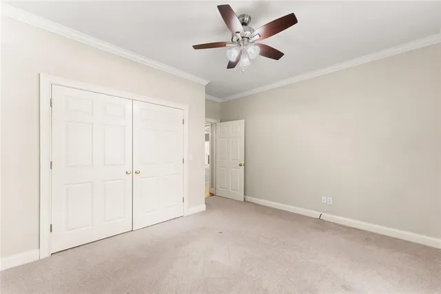 an aerial view of a house with a yard and balcony