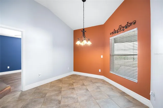 a view of a room with windows and entryway