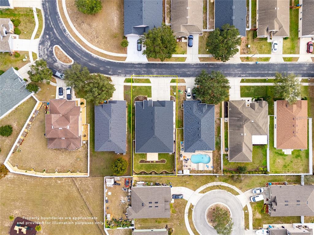 13413 Mandalay Place Spring Hill, FL 34609 - Photo 2 of 46 an aerial view of a residential apartment building with a swimming pool