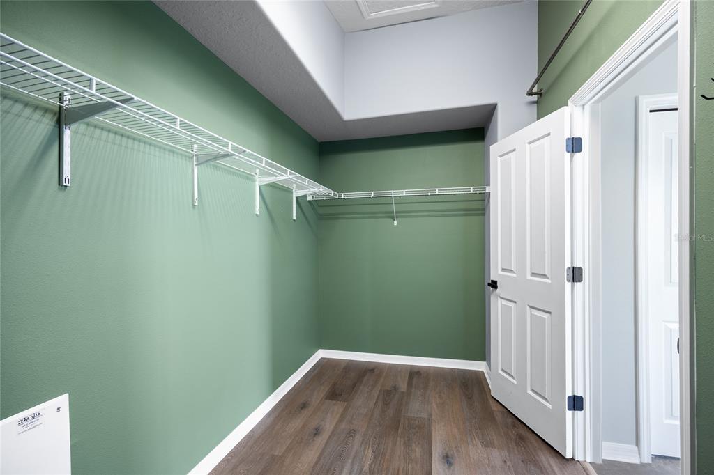 13413 Mandalay Place Spring Hill, FL 34609 - Photo 25 of 46 a view of a room with wooden floor and white walls