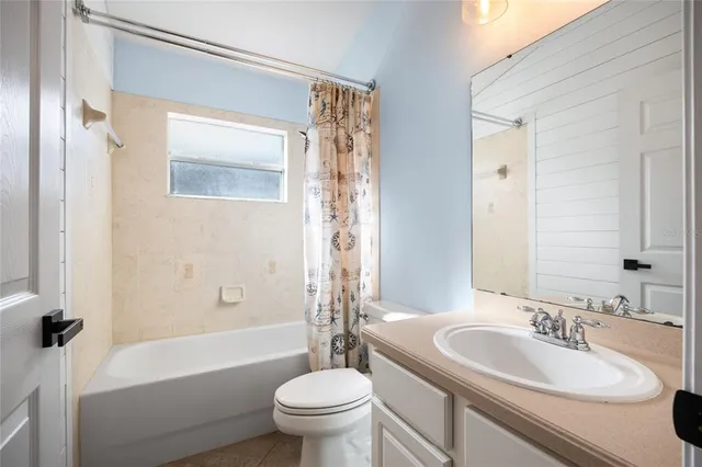 a bathroom with a sink a toilet and a bathtub