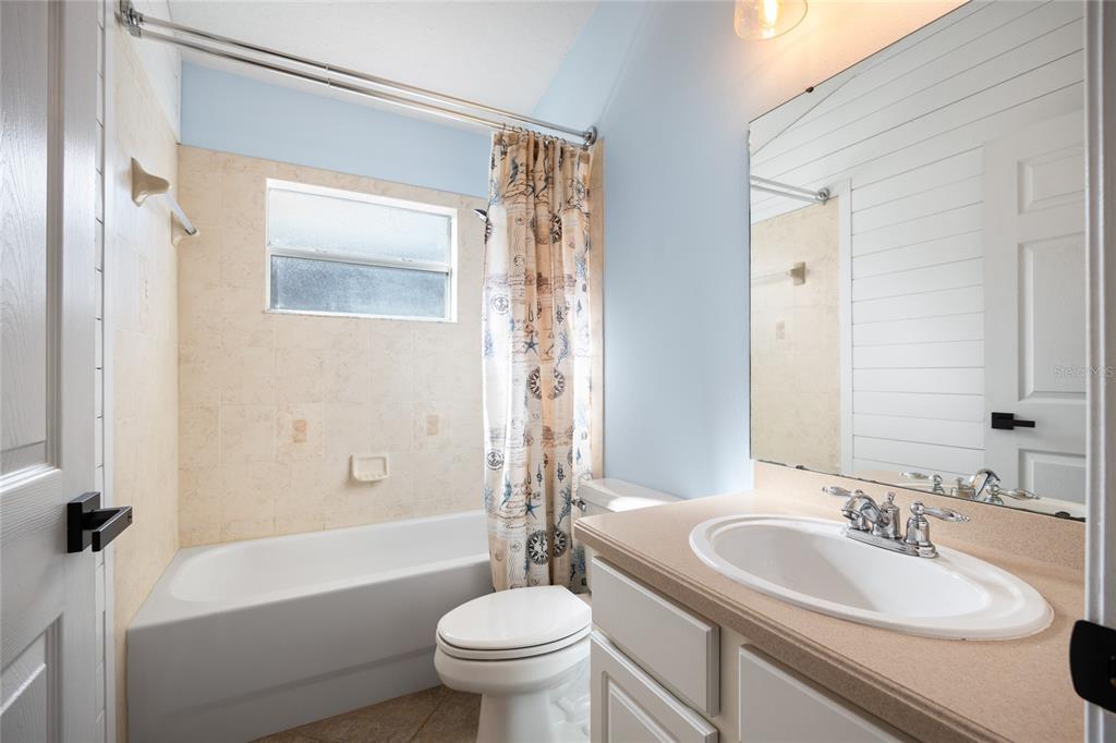 13413 Mandalay Place Spring Hill, FL 34609 - Photo 31 of 46 a bathroom with a sink a toilet and a bathtub