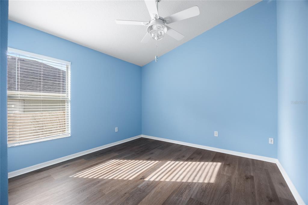 13413 Mandalay Place Spring Hill, FL 34609 - Photo 32 of 46 wooden floor in an empty room with a window