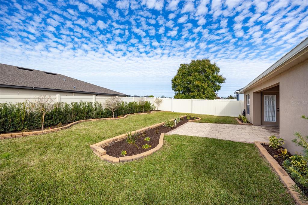 13413 Mandalay Place Spring Hill, FL 34609 - Photo 38 of 46 a view of a backyard with plants