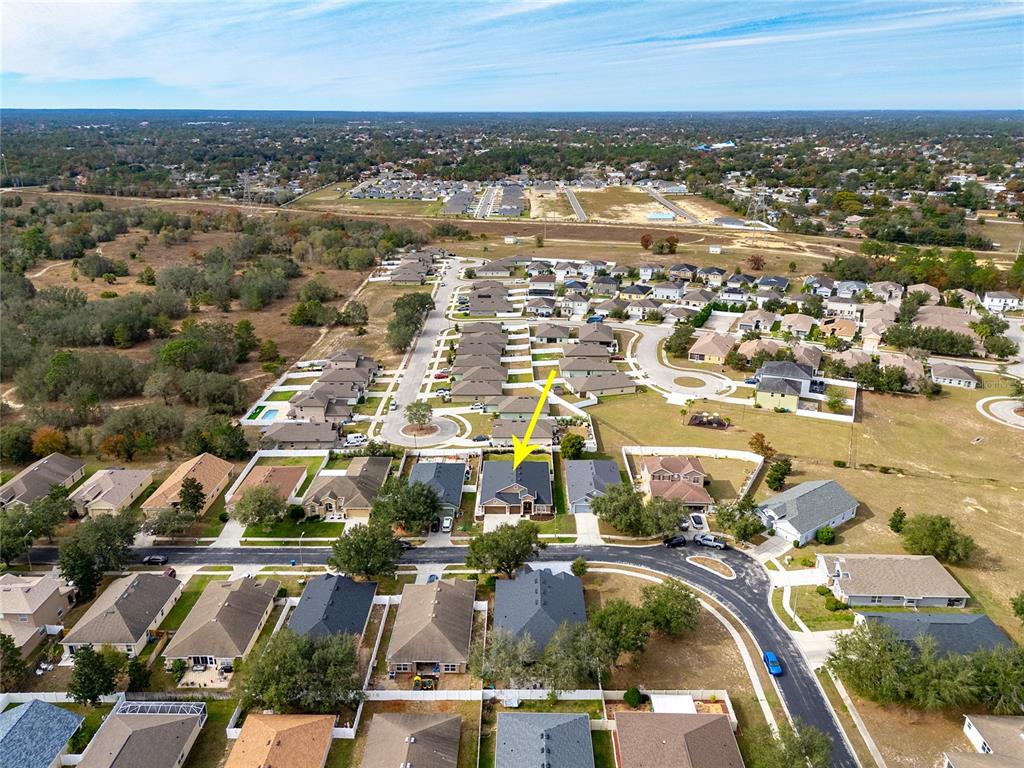 13413 Mandalay Place Spring Hill, FL 34609 - Photo 43 of 46 an aerial view of residential building and lake
