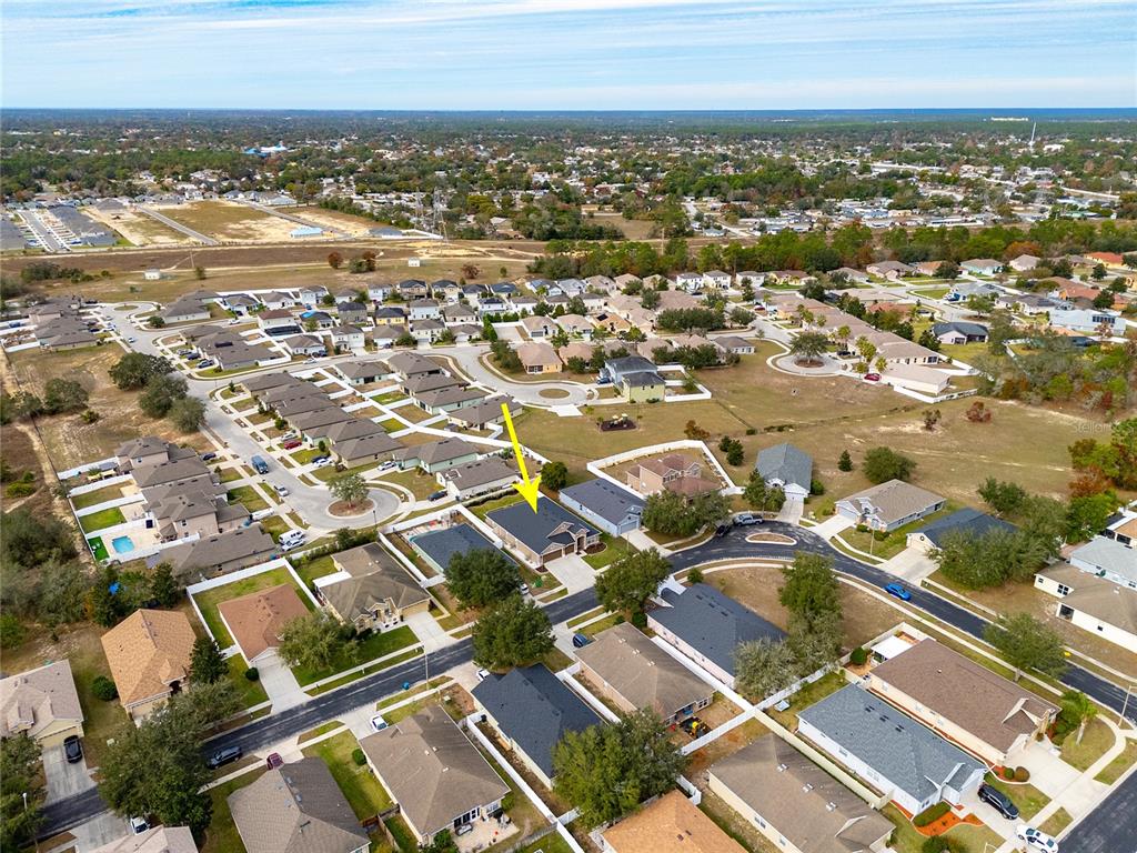 13413 Mandalay Place Spring Hill, FL 34609 - Photo 44 of 46 an aerial view of residential building with parking