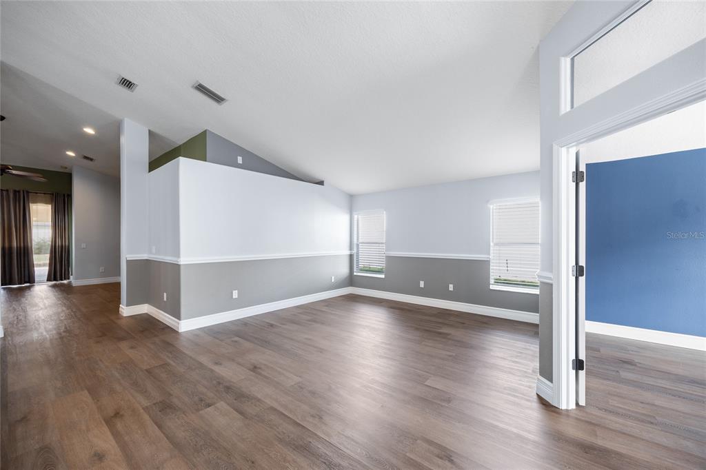 13413 Mandalay Place Spring Hill, FL 34609 - Photo 7 of 46 a view of a livingroom with wooden floor